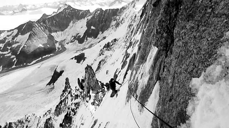 Traversing above gendarme on east arête of Birkett Needle. 