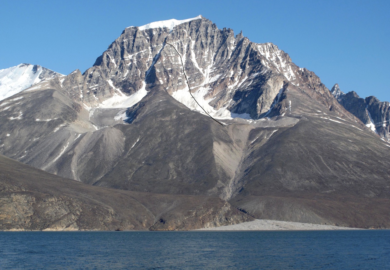 North face of Peak 1,600m on Alfred Wegener Halvo rises above Kangerdluarssuq Fjord. Italian attempt marked.