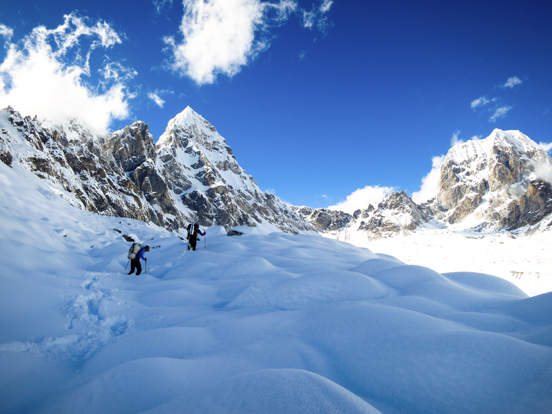  Scott Adamson and Chad Kellogg hike through the Hellplex toward advanced base camp. Pangbuk North is center left, and Lunag West is on the right. 