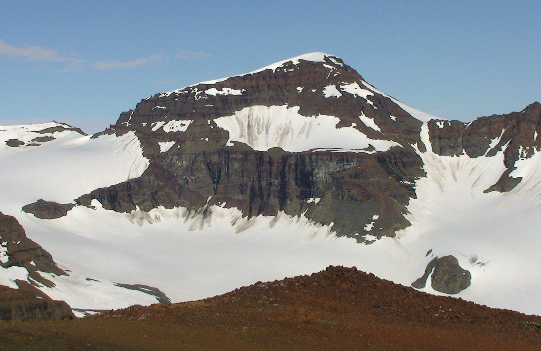 Quests Tinde (1,200m) seen from a smaller peak to the west-southwest. Quest was the name of the boat that brought Lawrence Wager to the area in 1936.  