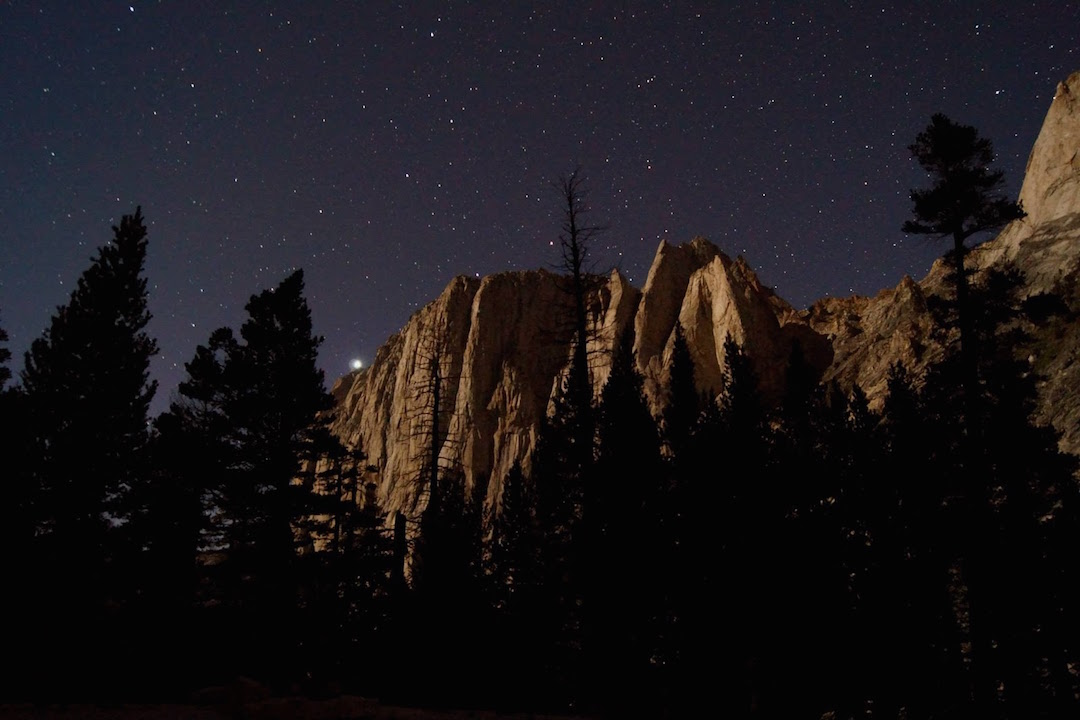 The headlamps of Adam Ferro and Vitaliy Musiyenko visible atop the southwest buttress of Angel Wings
