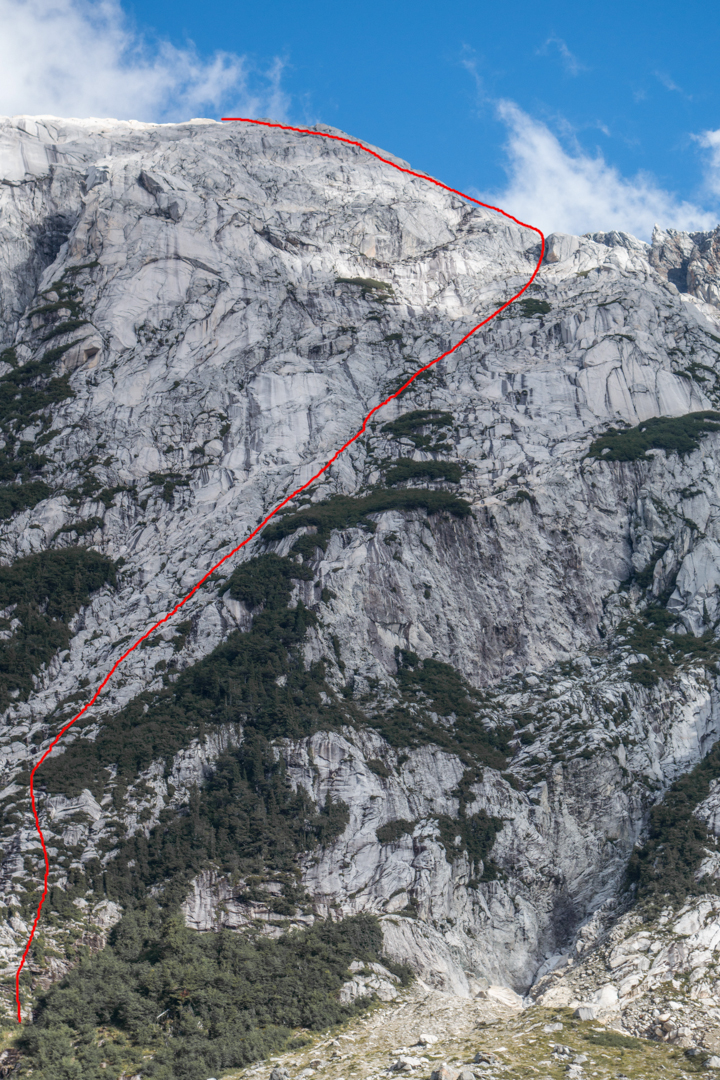 The route the 2017 team called Margherita (900m, low fifth-class), left of the Oreja, which could be the same as the 2011 route Earlobe. The elevation of the summit is 2,100m.