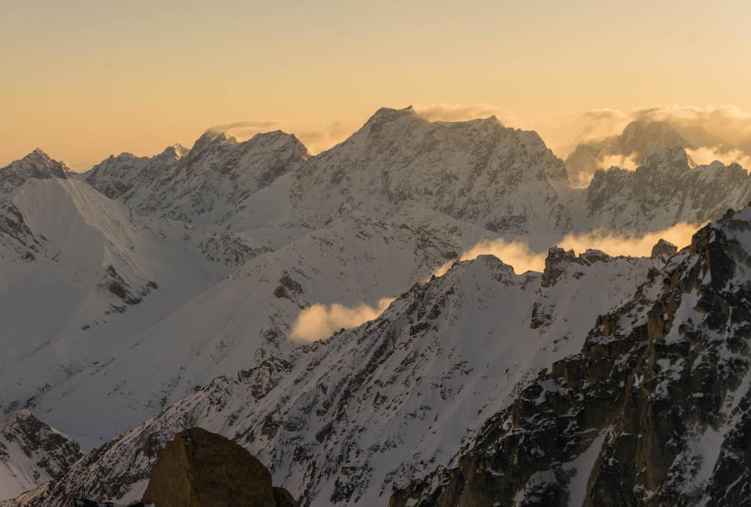 Sunset view from the bivy during the first ascent of Fun or Fear (1,200m, M6+ AI6 R 90˚) on the east face of Jezebel (9,620’) in the Revelation Mountains. 