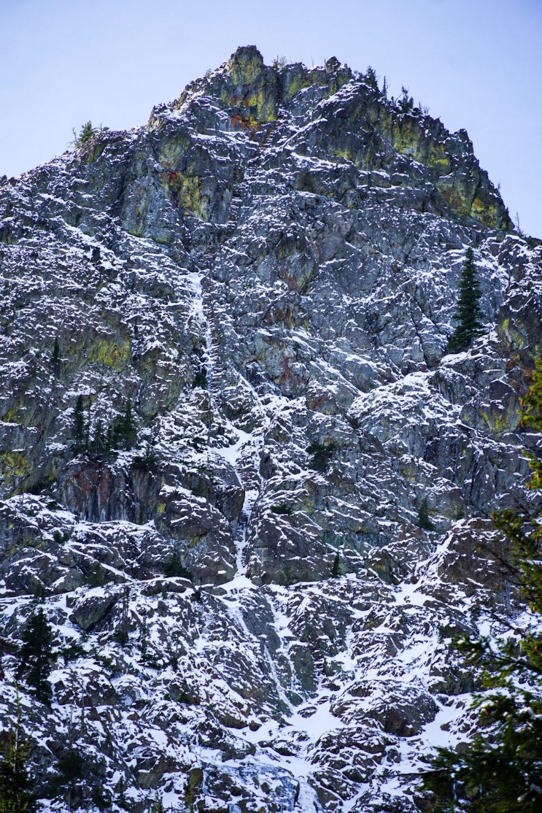 The upper northeast face of Esmeralda Peak East. Moonlight Serendipity (1,200’, WI3 M5) follows obvious ice runnels, angling up ramps to the right near the top.