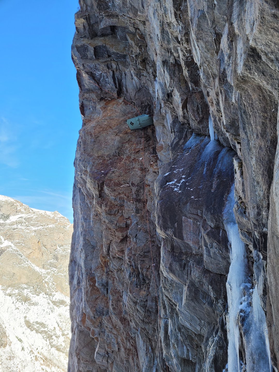 Matt Ward’s portaledge hanging at the pitch one anchor on Death of a Sinner on the northwest face of the Giants Foot. The visible water-ice formations had been flowing water before a sudden storm and temperature drop at the beginning of Ward’s ascent. 