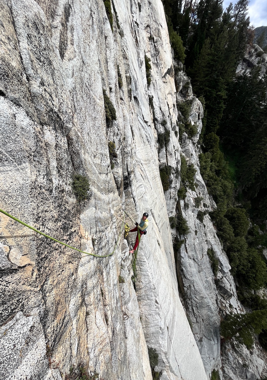 Brandon Thau belaying at the bottom of pitch four during the first ascent of Woodburner (9 pitches, 5.11-).