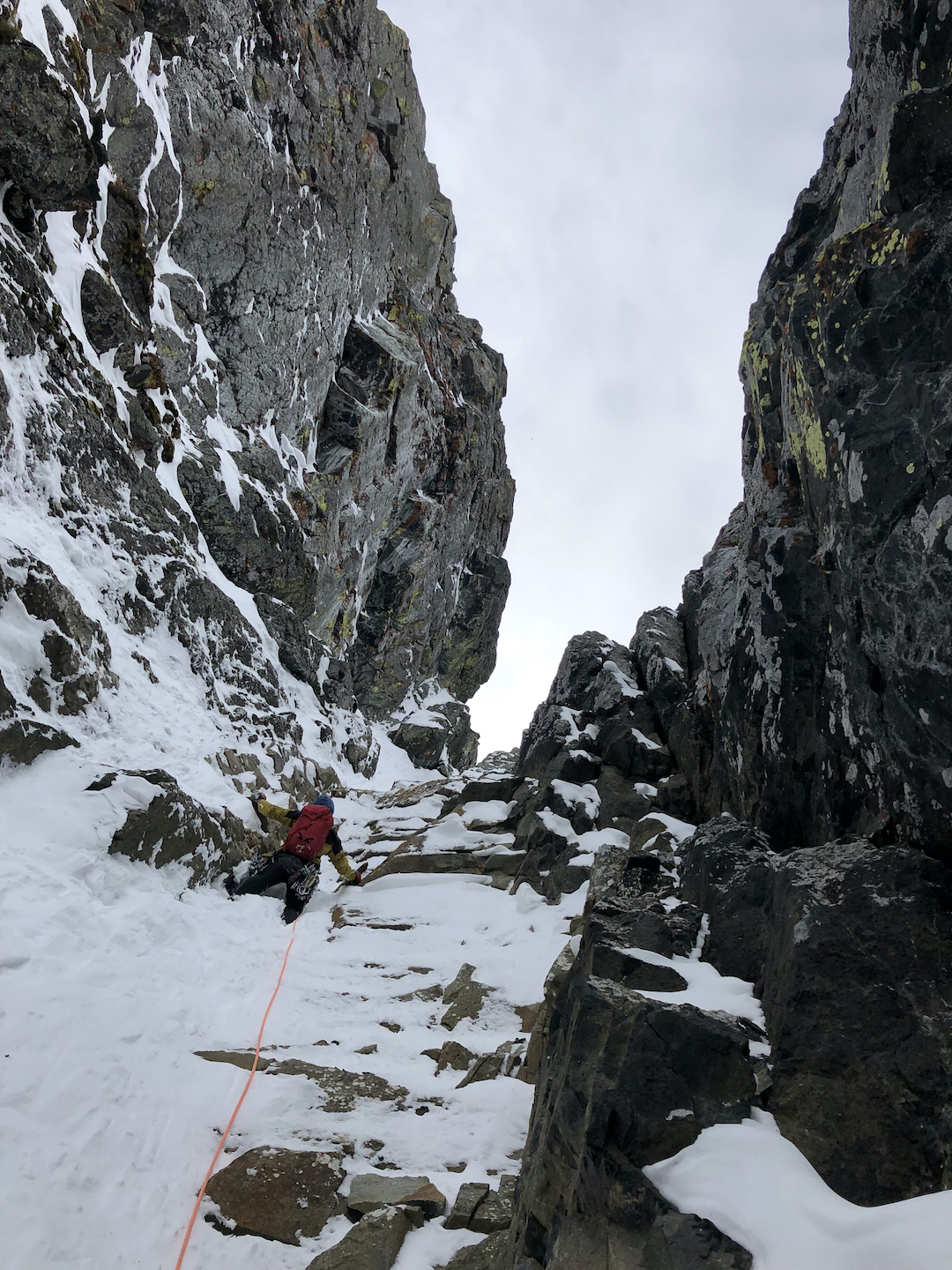 Matt Ward climbing easier ground on Never Take Our Freedom! (1,200’, IV M6 70° snow), likely the first route up the Scottish Wall, a 1,200’ cliff in the northern Absaroka Range, Wyoming. 