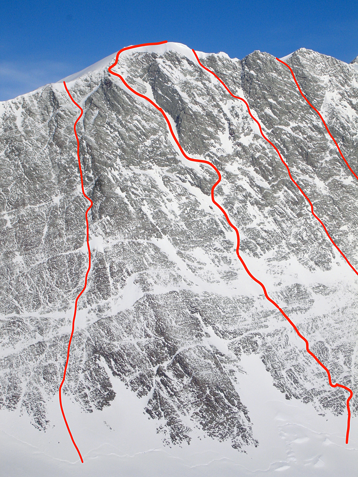 The west face of Branscomb Peak. From left to right: Chilena-Slovak Route (2007), Hennessey-Honnold-Mena-Opp (2023), Linear Accelerator (1994), and Conjugant Gradients (2006). 