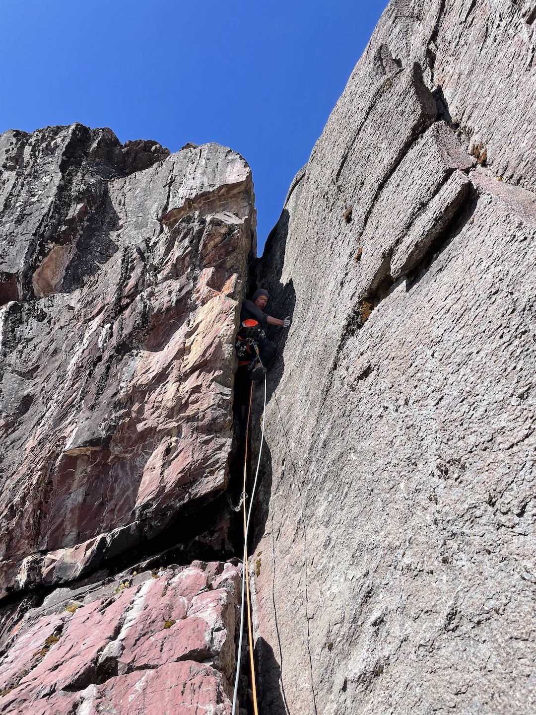 Pete Takeda leads up a rock chimney on the west face (800m, ED- 5.9 80°) of Nevado Tinki (5,450m). 