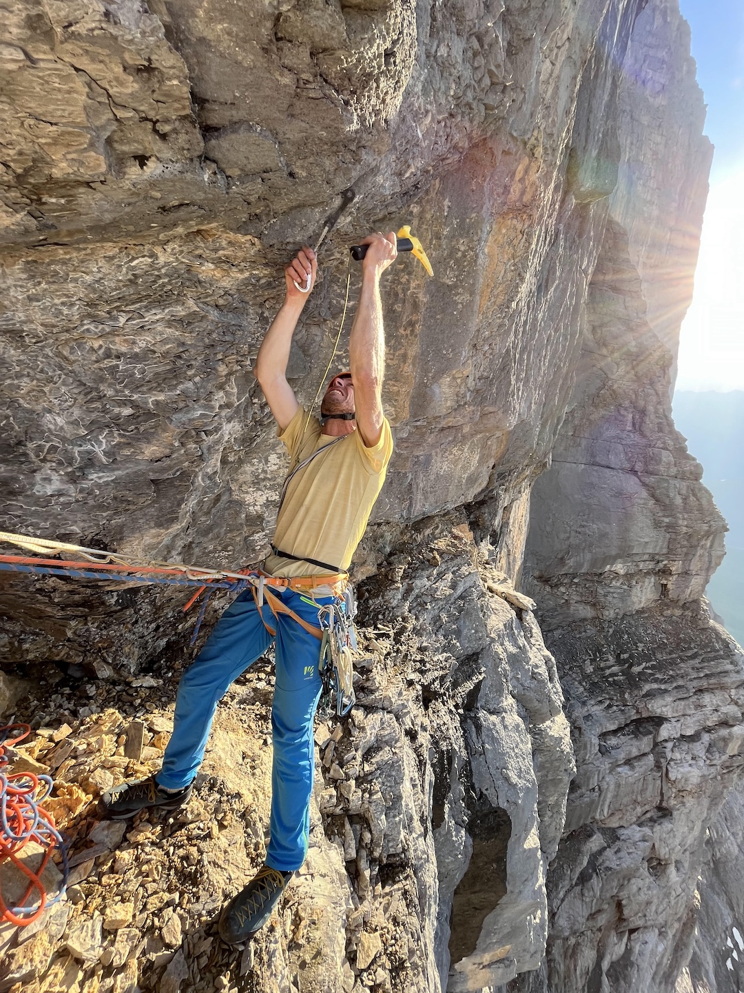 Silvan Schüpbach hammers in a Pecker for the boulder problem at the start of pitch seven, rated approximately 7c/5.12d. 