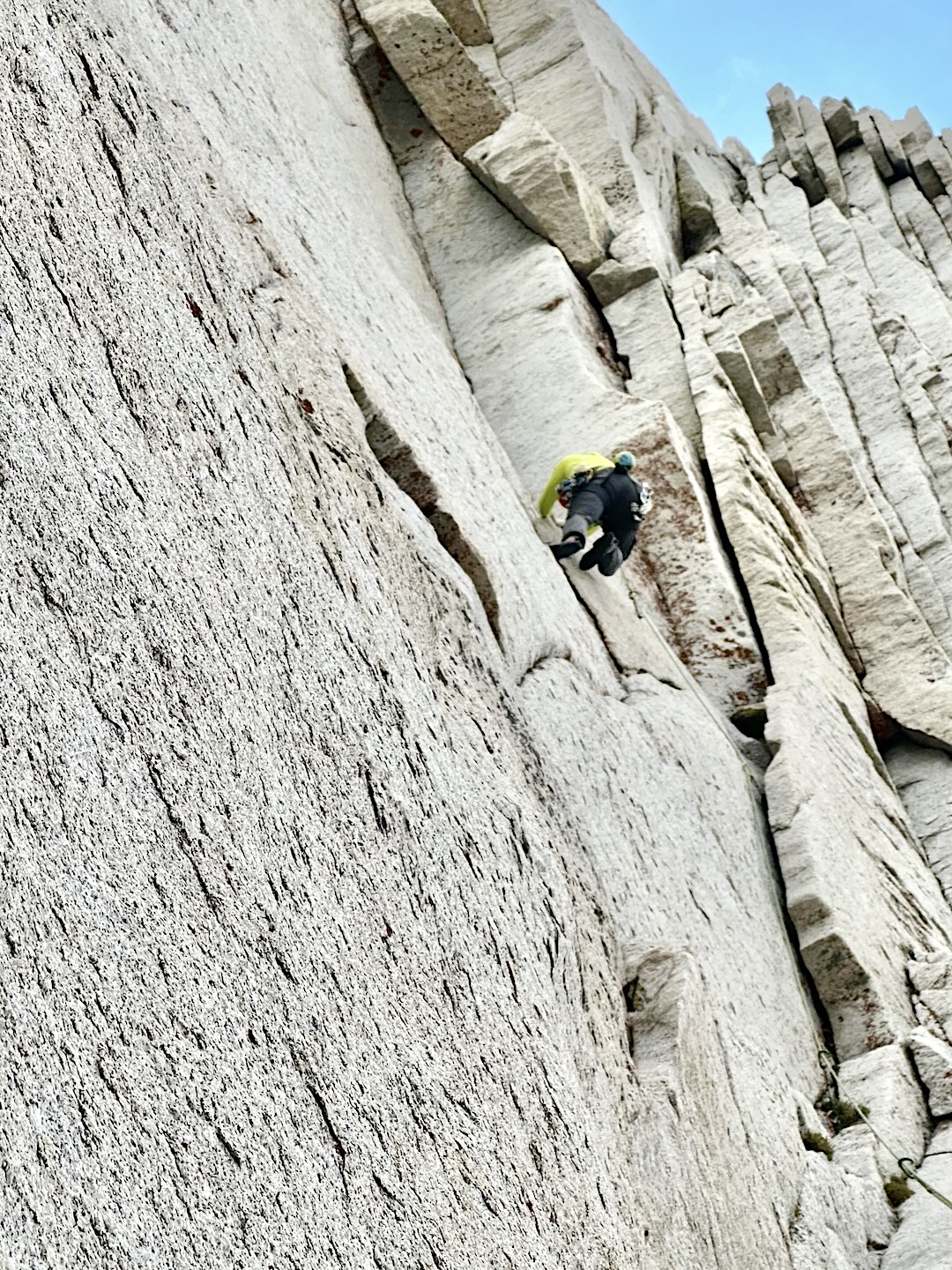Jarod Sickler entering the corner beneath the bomb-bay chimney on the 5.11c fourth pitch of Infinity Gauntlet (12 pitches, IV 5.11d). 