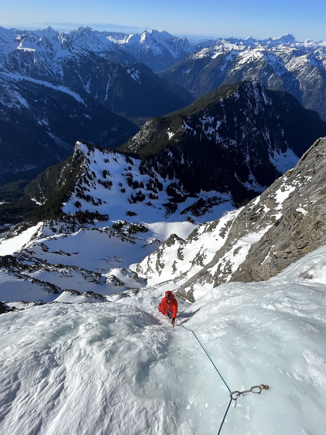Justin Sackett follows perfect blue ice to the top of the dagger on the crux fifth pitch of Borrowed Time.