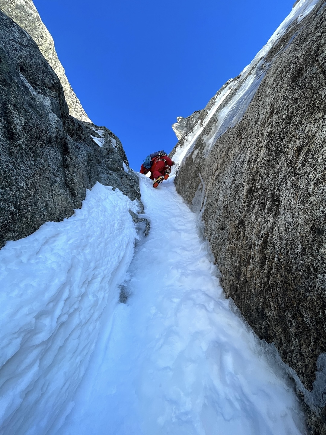 Justin Sackett leads the way through a short step of alpine ice high on Borrowed Time.