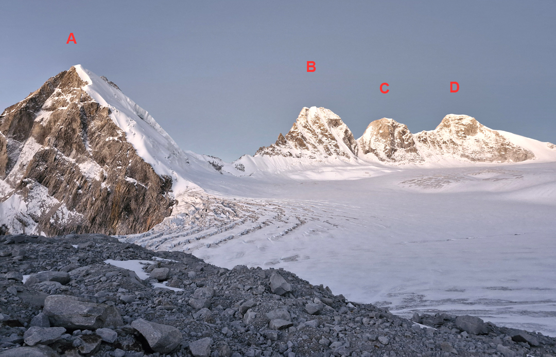 Looking west across the southern part of the Angsi Glacier Basin. (A) Peak 6,013m. (B) Peak 6,119m. (C) Peak 6,085m. (D) Angsi Dong Dong (6,171m). All but Peak 6,085m were climbed in 2024. 