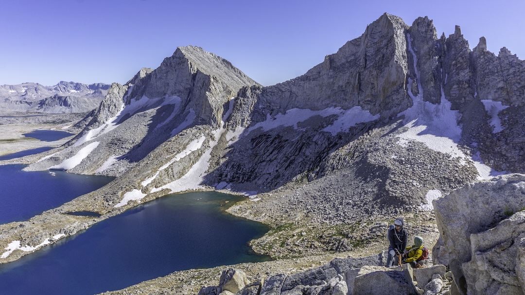 Dan Wolfskill (left) and Mike Hathorn descending off the summit blocks of Golden Trout Spire after the first ascent of the formation, via a route called Dry Flyin’ (700’, 5.10b). The mountains in the background (south) are Royce Peak (left) and Feather Peak.
