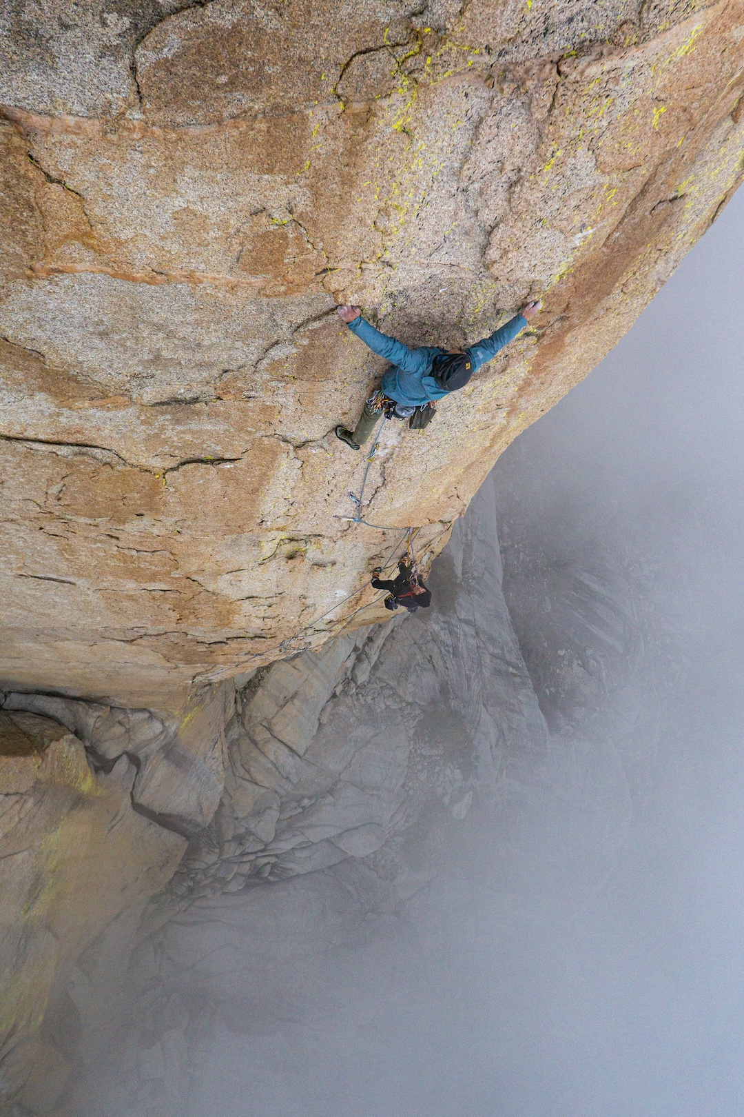 Josef Maier, belayed by Neal Harder, on the incredible chicken heads of the 5.11b fourth pitch of Home Run (650’, 6 pitches, 5.12a) on Homers Nose. 