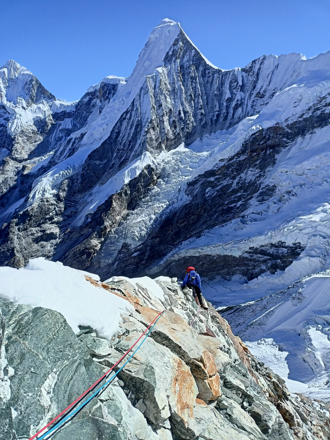 On the lower northeast pillar of Chobutse with Peak 6,664m (north of Takargo) behind.