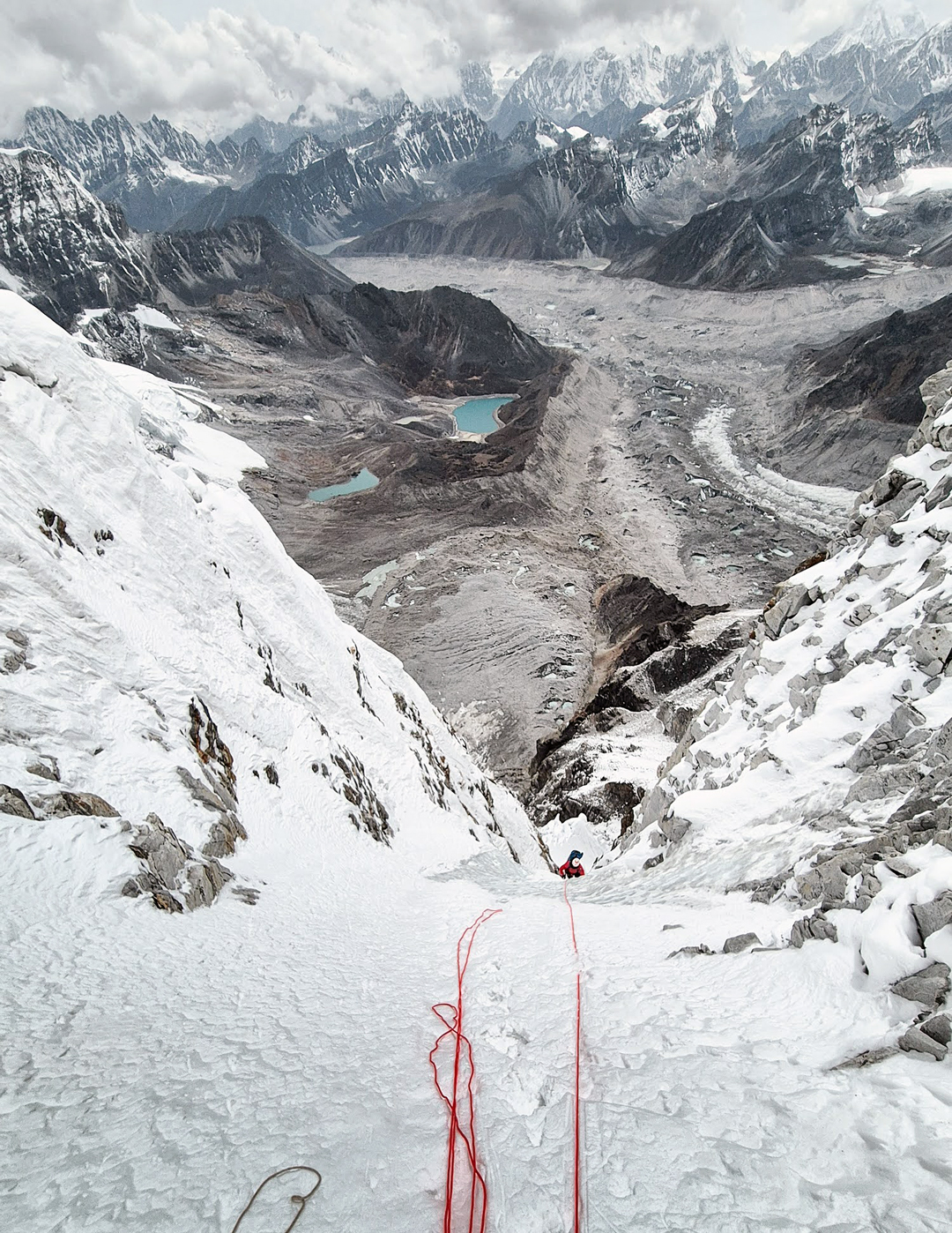 Runnel climbing on the west face of Hungchi with the Ngozumpa Glacier and the peaks of the Rolwaling behind.  