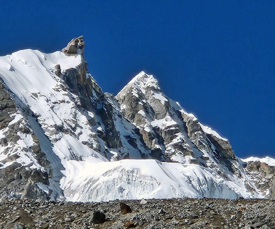 Sharphu III from the southeast. The Korean expedition reached the base of the foresummit rock tower. The highest point is the snow summit to the right.