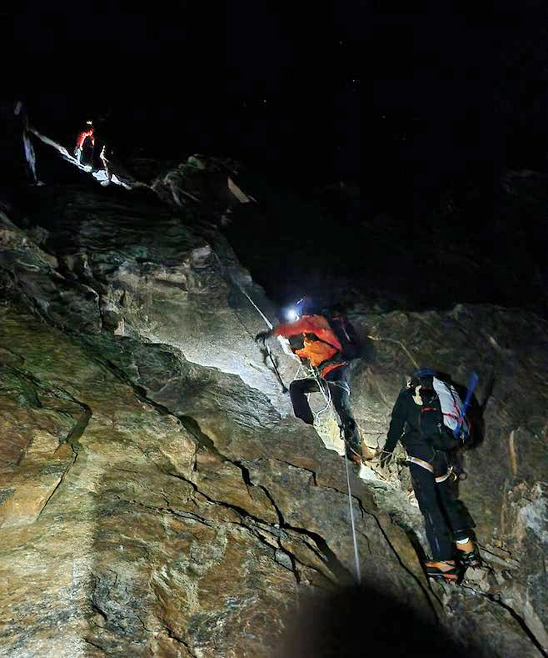 Climbing to the col between Sato Peak and Sharphu III early on summit day.