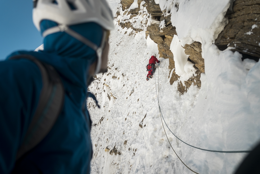 Akihiro Oishi, belayed by Hiroki Suzuki, traverses insecure crumbling snow on the fourth day of the ascent of Pandra’s northeast face. 