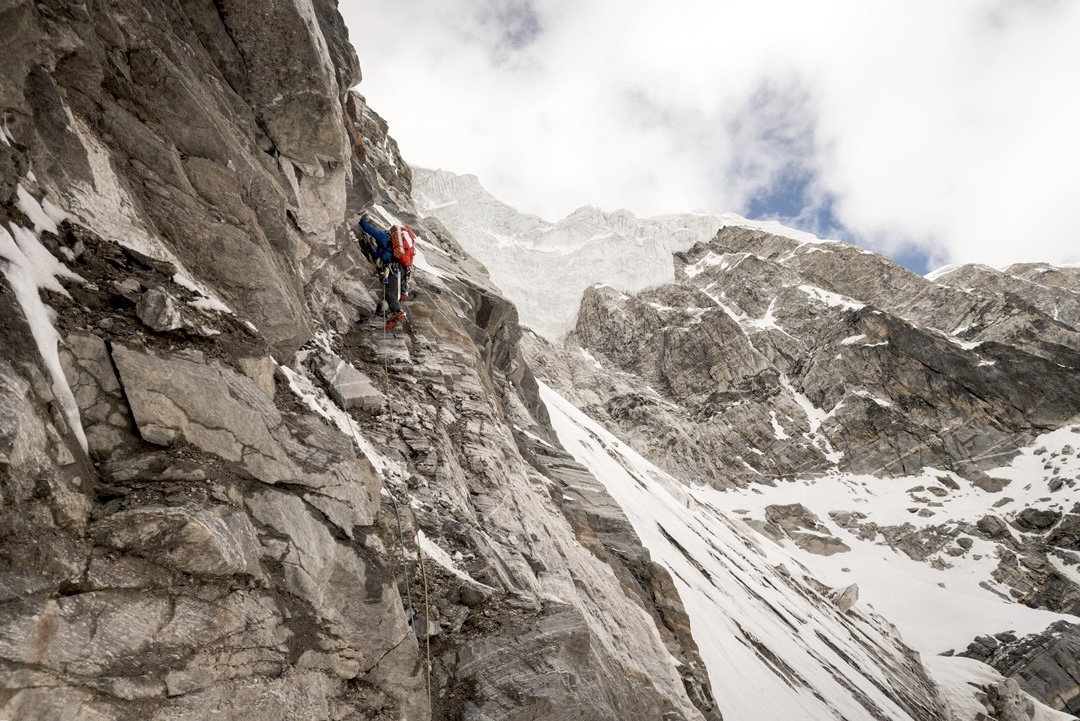 Hiroki Suzuki climbs the loose first pitch on the northeast face of Pandra. 