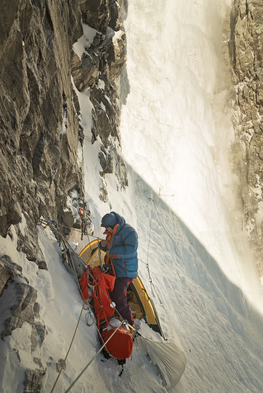 Using a snow hammock, the three Japanese climbers made a constricted bivouac at the end of day two on the northeast face of Pandra.