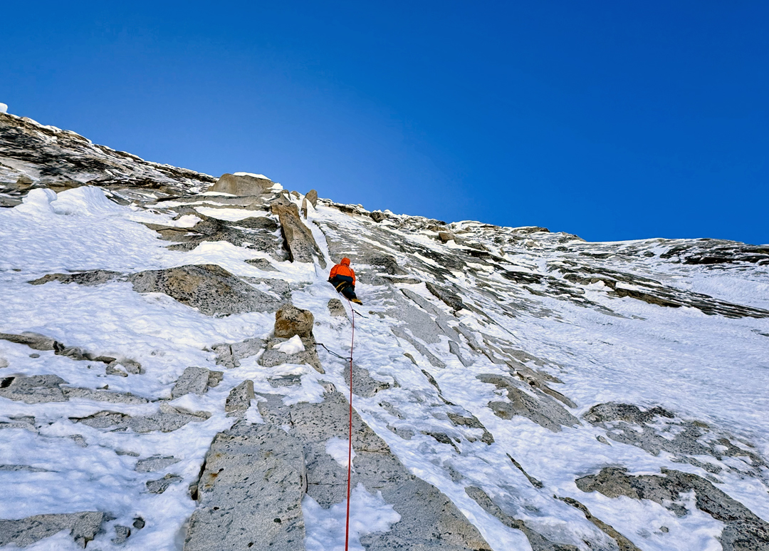 Hidesuke Taneishi negotiating the first crux—the steep, very thinly iced wall—at the start of the upper north face of Phole.