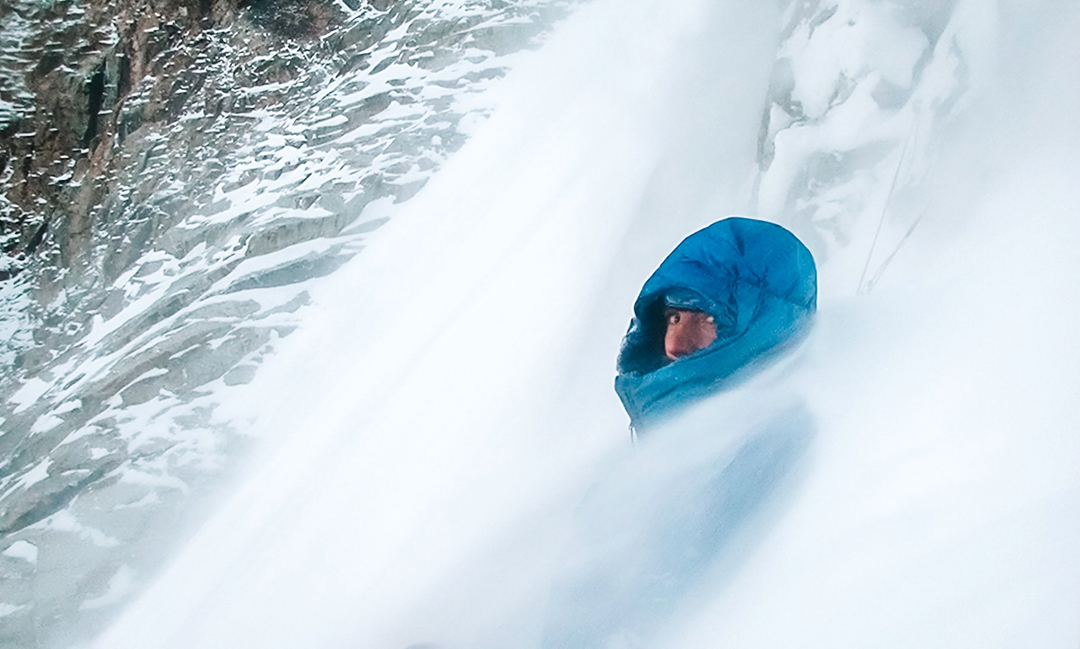 Louis Rousseau at the last bivouac during an attempt on an unnamed peak above the South Lupghar Glacier. Rousseau and Adam Bielecki were stuck for three hours in these conditions before a lull enable them to descend.