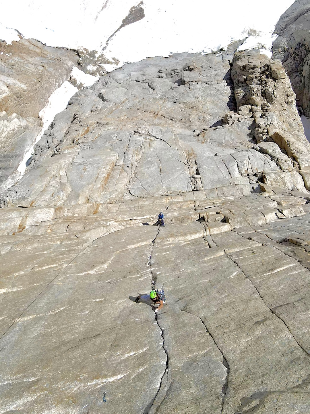 Looking down the Gemstone Crack (pitch 11, 5.13c) of Keelhaul, Keeler Needle, with Chase Leary in the lead. This slightly overhanging finger and hand crack splits the center of the 300-foot Keeler headwall at around 14,000 feet.