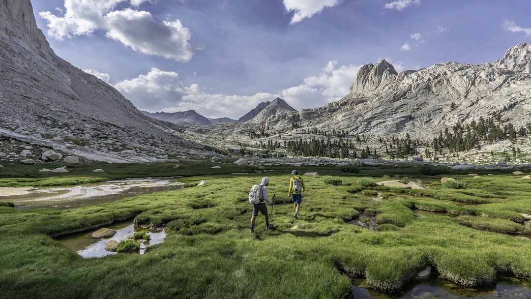 Japhy Dhungana (left) and Rainbow Weinstock hiking into the Sky Blue Lake drainage (a.k.a. Miter Basin). The Miter is the peak on the right. 