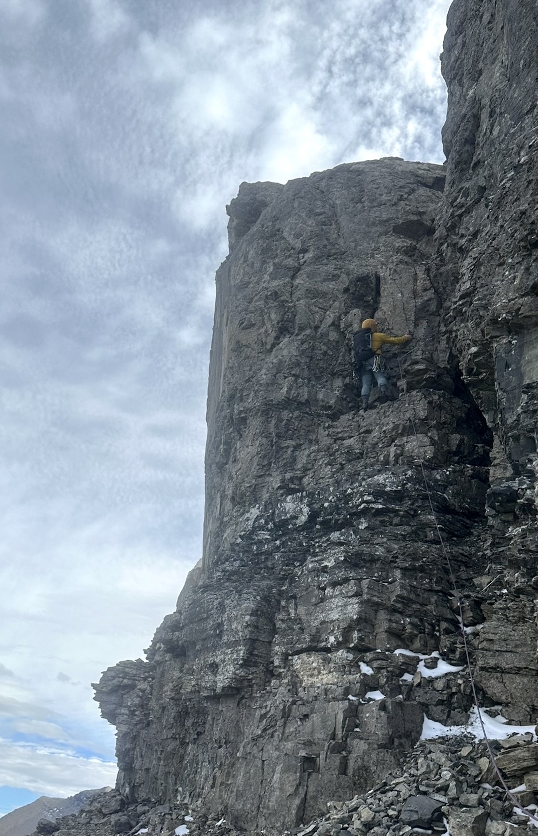 David Steele leads a pitch through the algal reef formation on the north face of Flinsch Peak during the first ascent of Loaded for Bear (IV 5.8). 