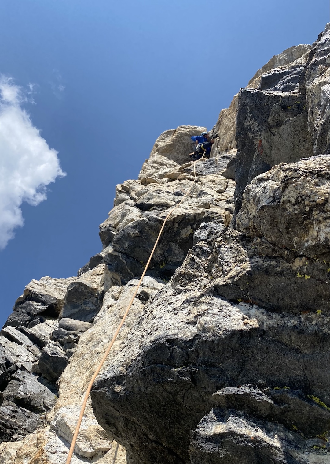 Michael Gardner leads the 5.10- second pitch of Wish You Were Here (III 5.10-) on the Grand Teton, Teton Range, Grand Teton National Park, Wyoming.