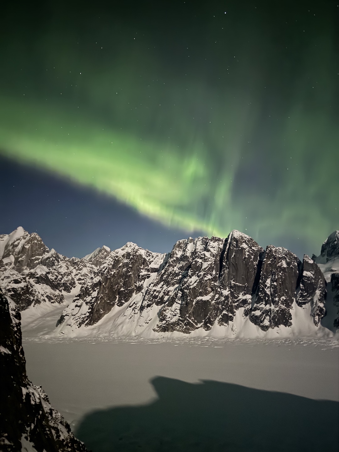 The aurora borealis seen over the London Tower group during Eli Spitulnik and Michael Telstad’s first night of climbing on Sports (4,660’, Alaska Grade V, 5.10 A1 AI4 M6 90° snow) on the southeast face of Mt. Bradley.