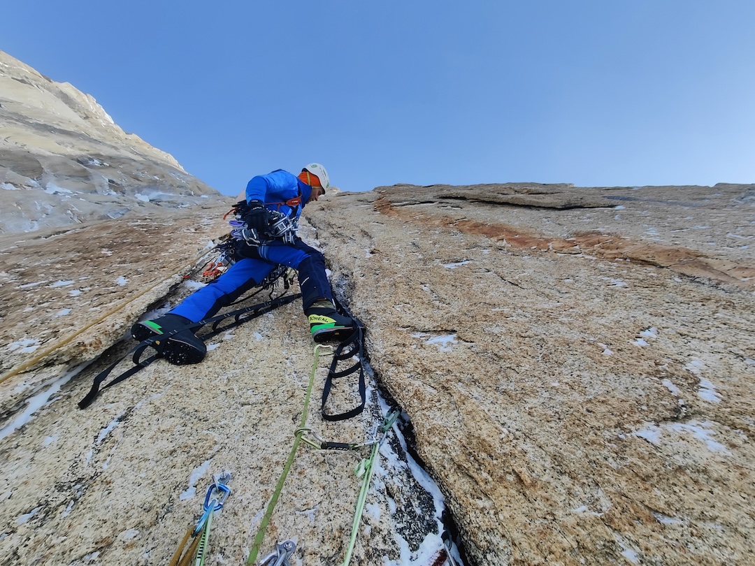 Marcin Tomaszewski about 500m up the wall, a pitch above the second bivouac on Cold Wars (980m, 19 pitches, M5+ A3 70° snow/ice).