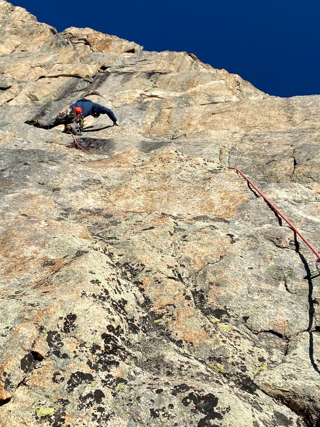 Will Beach leads out across rain-soaked slabs on pitch one of East Dihedrals (750’, 5.10d), Limbo, Indian Peaks Wilderness, Colorado. Some terrain here may be shared with the existing climb East Face Right. 
