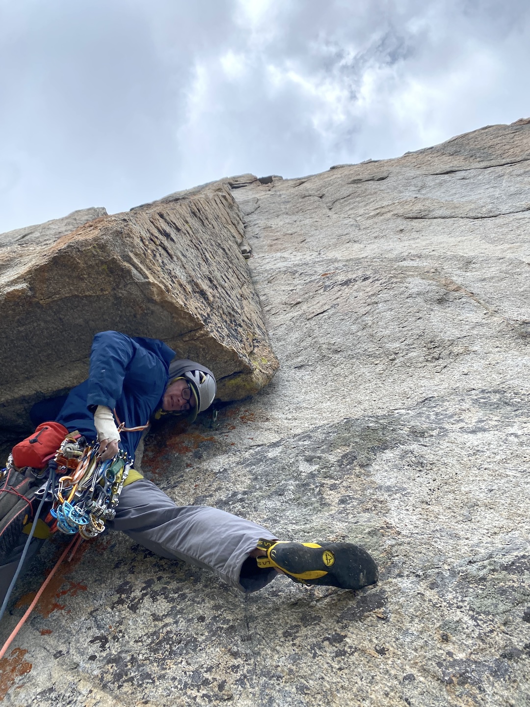 Pitch two of East Dihedrals (750’, 5.10d) on Limbo in the Indian Peaks Wilderness
 proved to be one of the cruxes, with appealing corner climbing on white granite. Here, Will Beach leads out through the opening roof. 