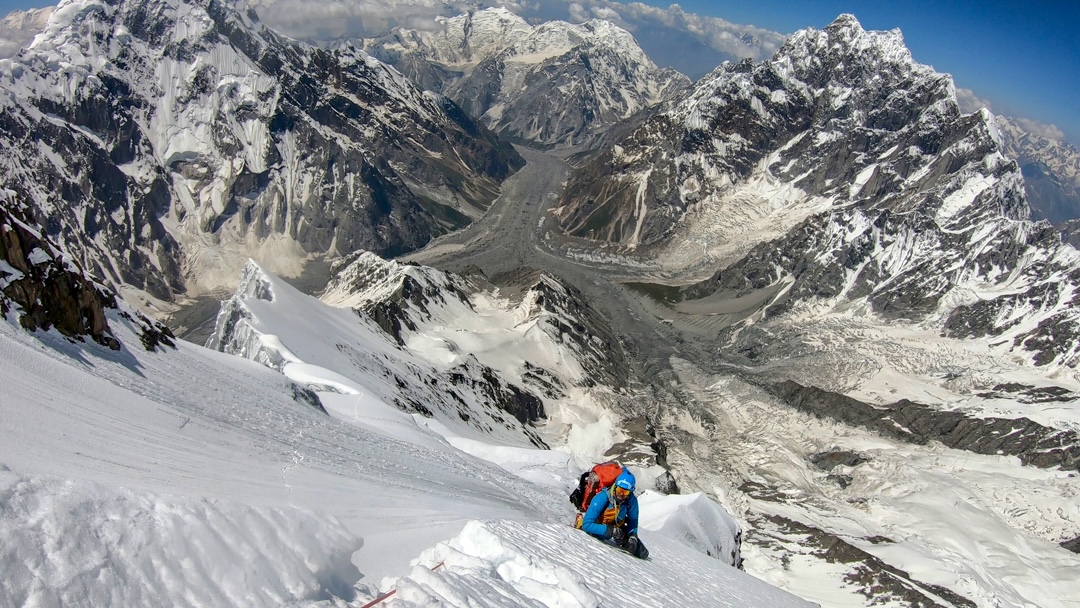 On the south spur of Batura V between camps 2 and 3. Below is the Muchuhar Glacier. Left is Sangmarmar (6,990m); in distant center is Malun Chhish (5,880m); and on the right is Hachindar Chhish (6,870m). 