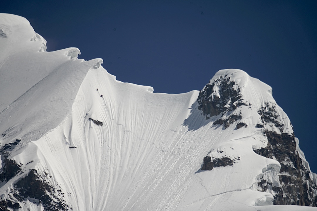 The three Czech climbers traversing the western flank of the south spur of Batura V, en route to Camp 3 and the first ascent of Muchu Chhish. 