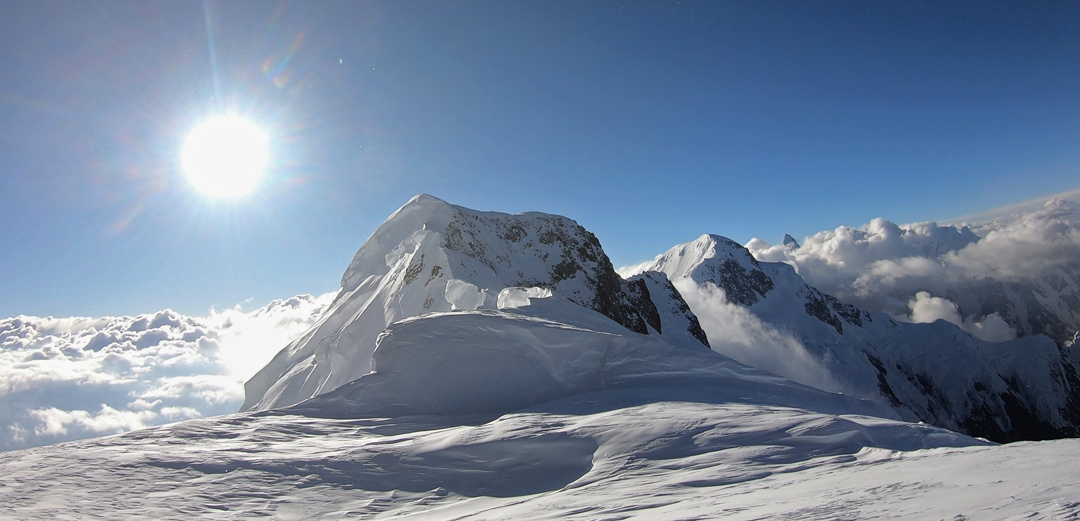 On the summit ridge of Muchu Chhish. The top, reached by a 150m headwall, is in front. Behind and right is Passu Sar (7,478m). 