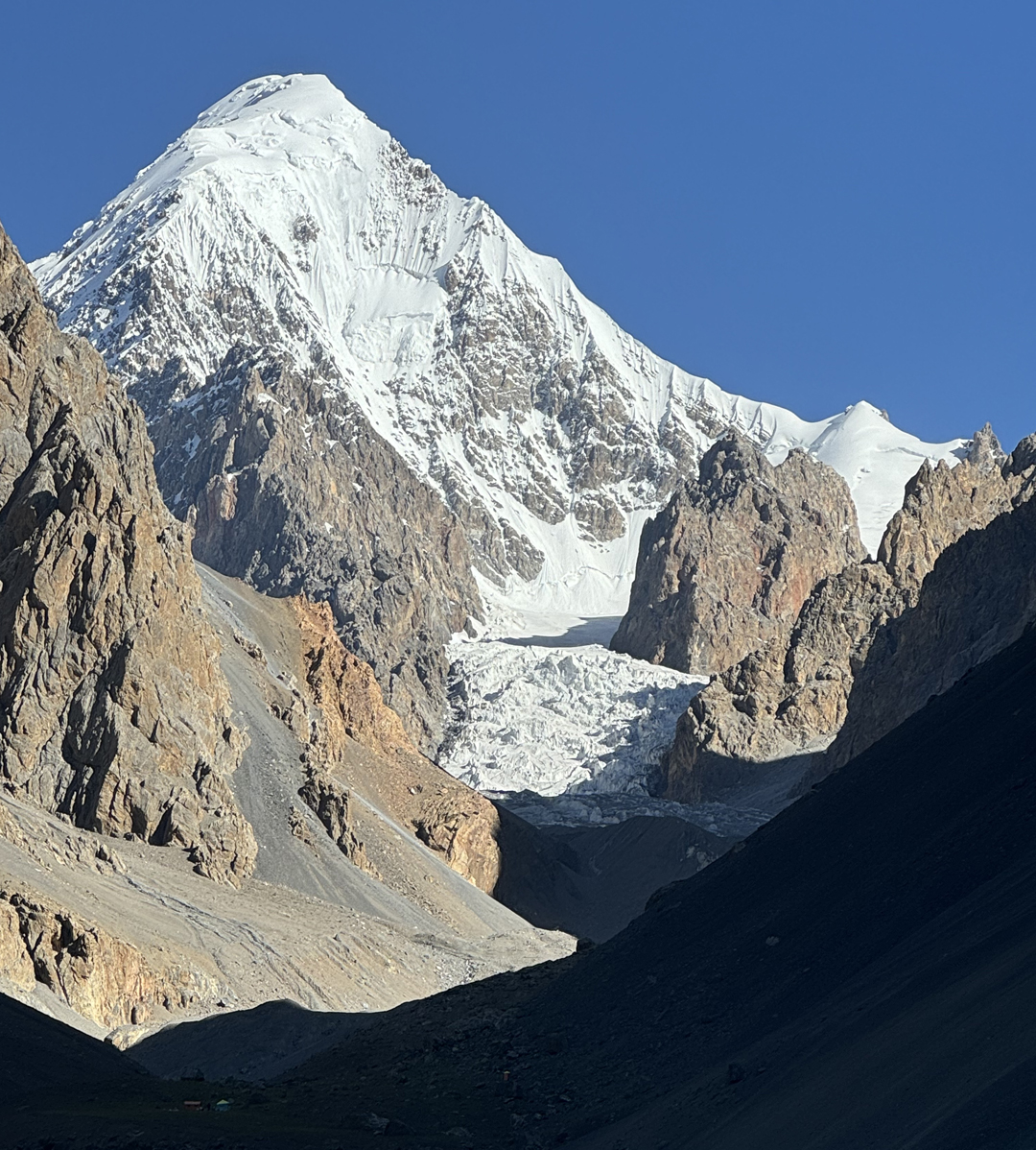 Looking up the Southeast Karun Glacier to Karun Koh. The southeast ridge forms the right skyline. To the right side of the picture, the large, chunky rock peak immediately above the icefall is Pozeve Sar, climbed in 2024.