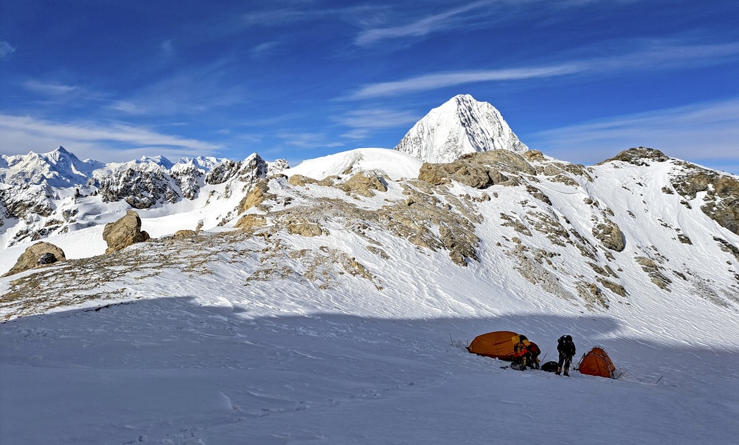 Camp 1 on the broad saddle at 5,700m dividing the Hidden and Spesyngov valleys, with Karun Koh in the distance.  