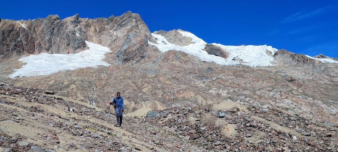 Descending from Cerro Amparay after the first known ascent, via the north face. The climbers ascended the glacial arm on the right to reach the summit. 