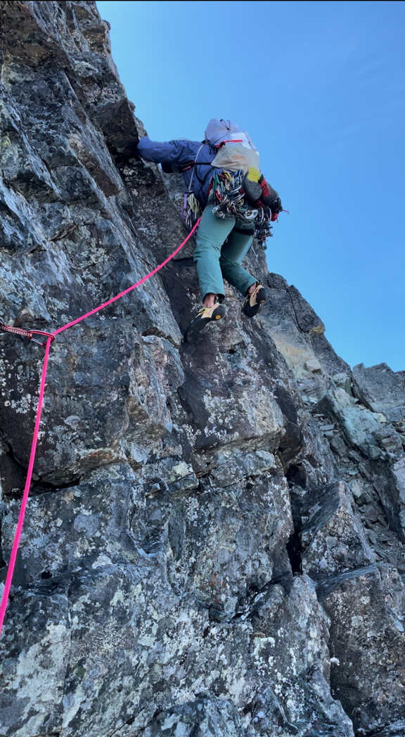 Andrew Councell leading up pitch four of the northeast ridge of Tsini Tsini Peak, with solid rock and great holds. 