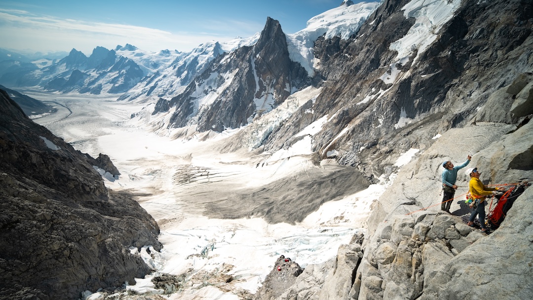 Tim Emmett and Will Stanhope eyeing the route up the Incisor above Madd Camp.