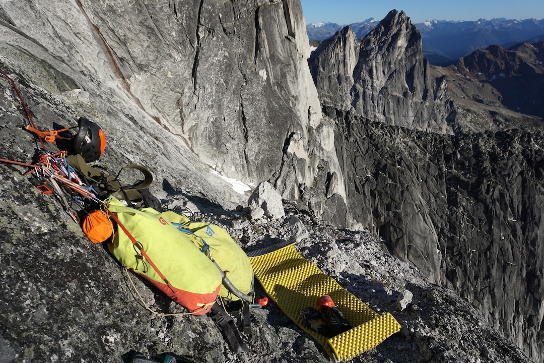 The bivy ledge around halfway up the west face of North Howser Tower during the first ascent of Rat Race (800m, 5.11+ A1).