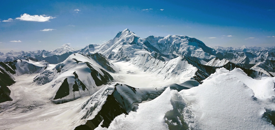 View from the summit of Laknak Kangri (6,496m). In the distance on the left is Chamshen Kangri (7,017m). Saser Kangri I (7,672m) is in the center, with Plateau Peak (7,310m) to its right.  