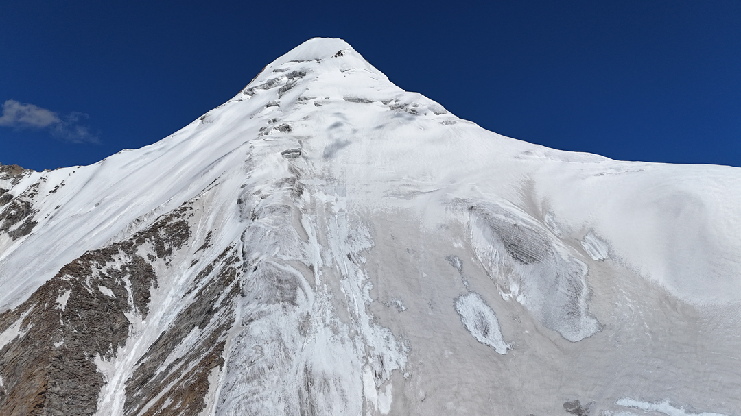Looking directly up the south-southeast spur of Nya Kangri. 

