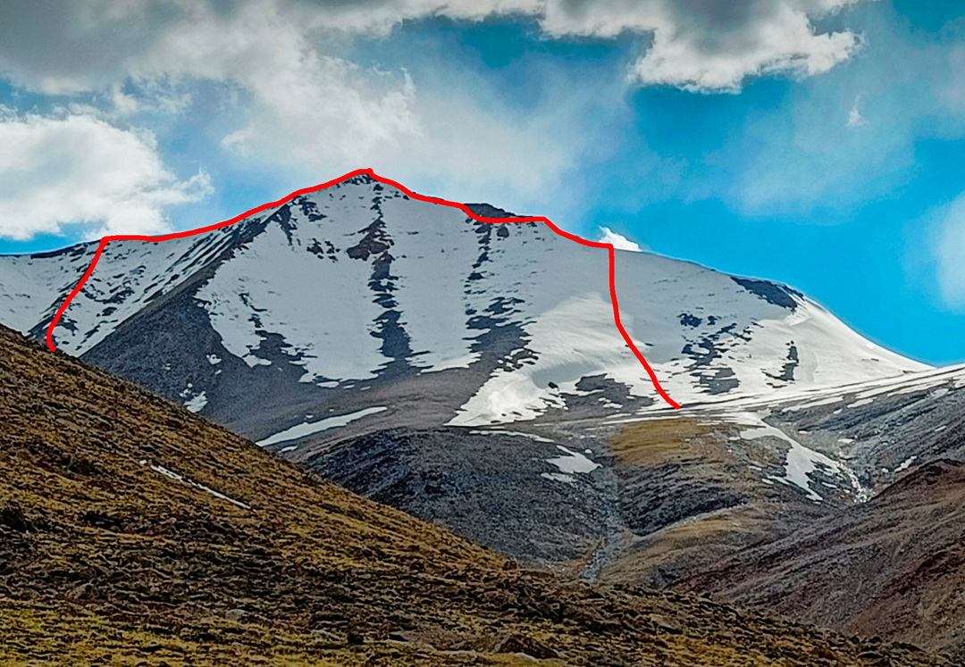 The east face and north-south (right-to-left) traverse of Peak 6,050m.  