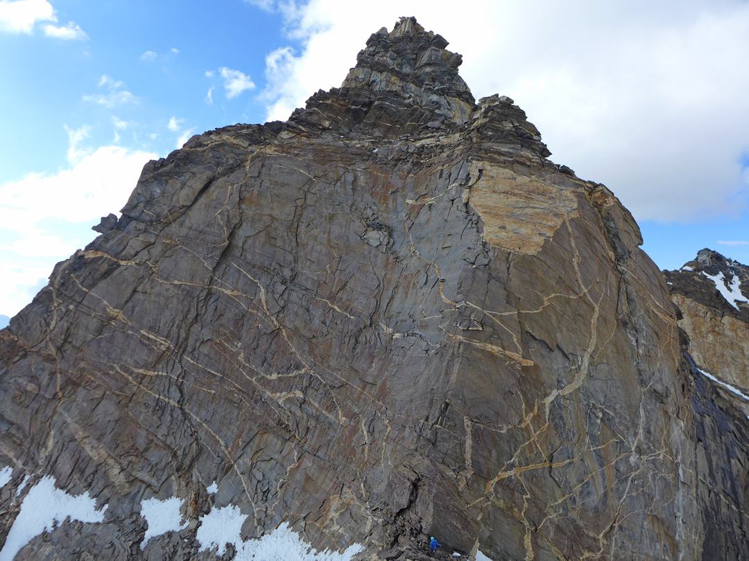 The final headwall on Starikatchan (5,904m). Tess Smith (in blue) can just be seen at the base.  
